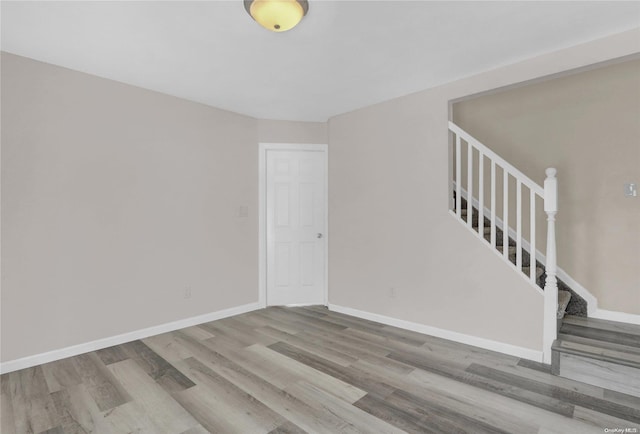 spare room featuring hardwood / wood-style floors