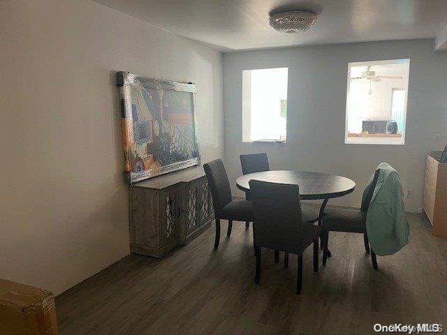 dining space featuring ceiling fan and hardwood / wood-style flooring