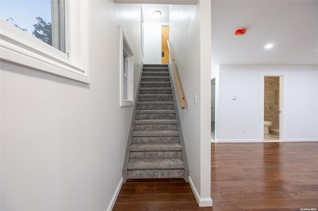 stairway featuring hardwood / wood-style flooring