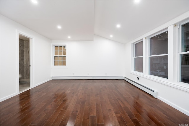 empty room with a baseboard radiator, vaulted ceiling, and dark wood-type flooring