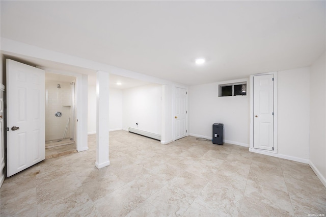 basement with a baseboard heating unit