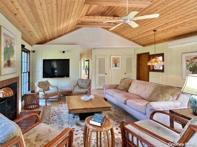 living room with ceiling fan, wood walls, wooden ceiling, and vaulted ceiling