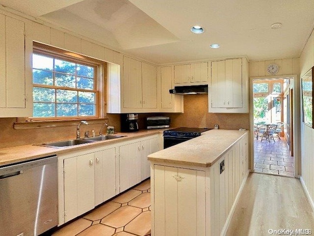 kitchen with dishwasher, black electric range oven, sink, light hardwood / wood-style floors, and white cabinetry