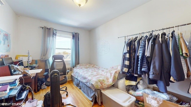 bedroom with light wood-type flooring