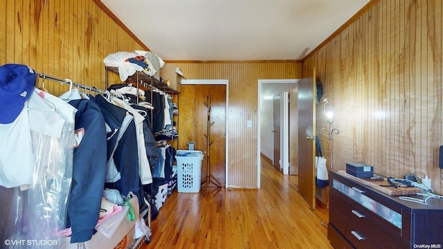 spacious closet with light hardwood / wood-style flooring