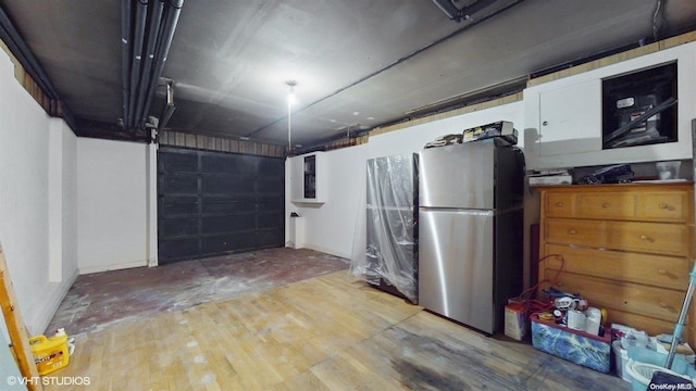 garage featuring stainless steel refrigerator