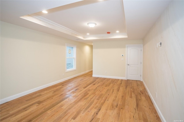 604 Meadowbrook Rd, North Merrick, NY 11566 - spare room with a tray ceiling, crown molding, light wood-style floors, recessed lighting, and baseboards
