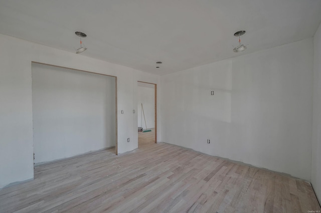 unfurnished bedroom with wood finished floors