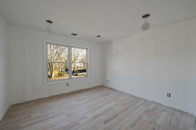 empty room with wood finished floors