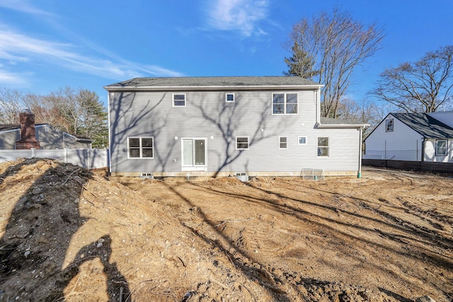 rear view of house with fence