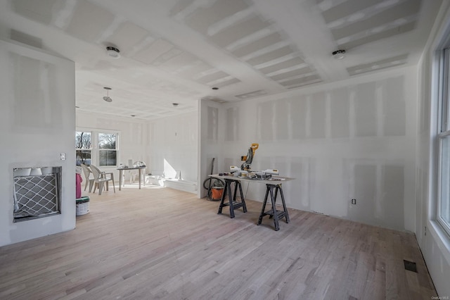 dining room featuring wood finished floors and visible vents