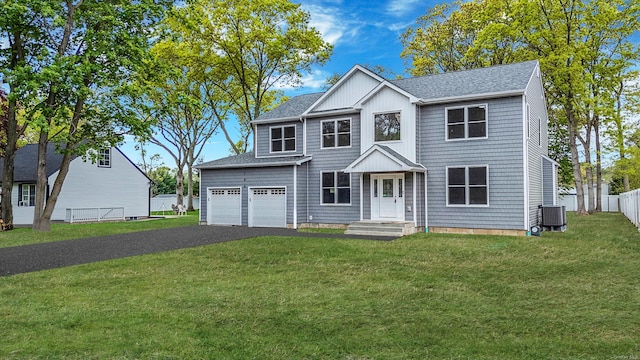 146 Walter Ave, Hauppauge, NY 11788 - colonial-style house with cooling unit, roof with shingles, fence, and aphalt driveway