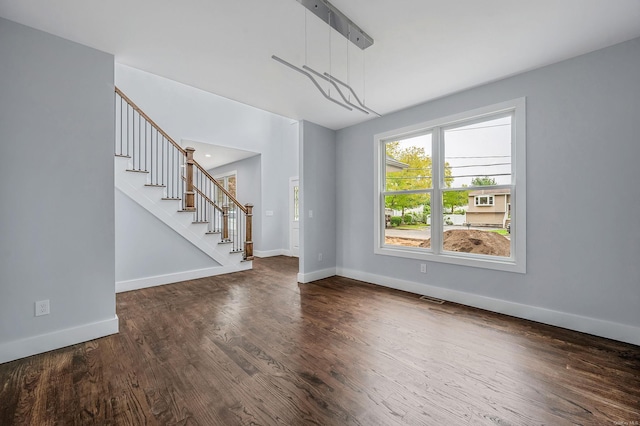 146 Walter Ave, Hauppauge, NY 11788 - interior space with baseboards, stairway, wood finished floors, and visible vents