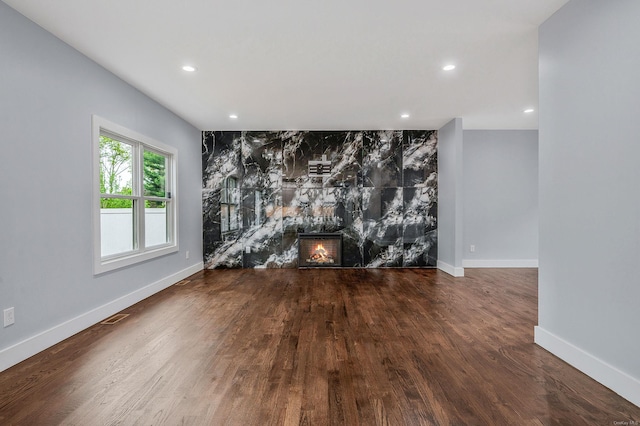 146 Walter Ave, Hauppauge, NY 11788 - unfurnished living room featuring baseboards, wood finished floors, a fireplace, and recessed lighting