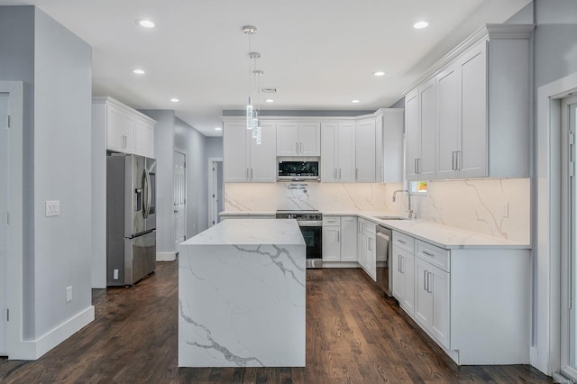 146 Walter Ave, Hauppauge, NY 11788 - kitchen with dark wood-style flooring, stainless steel appliances, a kitchen island, and recessed lighting