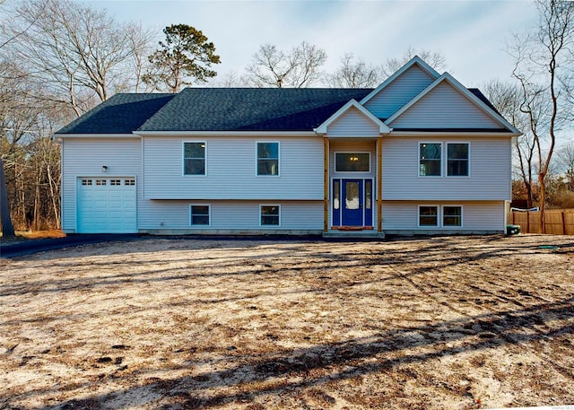 bi-level home featuring a garage