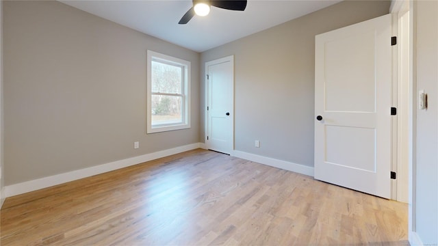 unfurnished bedroom with ceiling fan and light hardwood / wood-style flooring