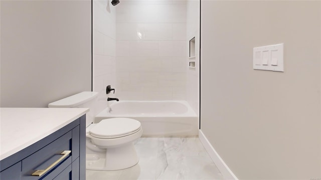 full bathroom with tiled shower / bath, vanity, and toilet