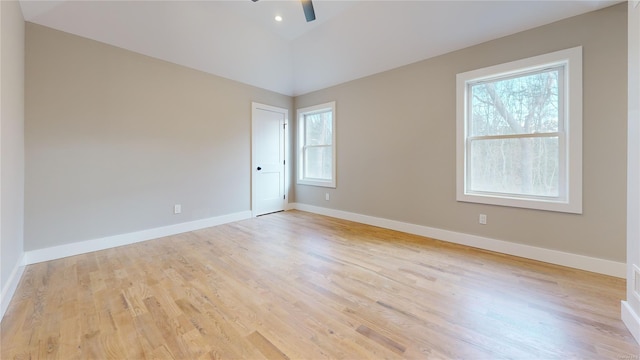 spare room with ceiling fan and light wood-type flooring