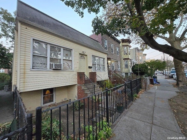 view of front of home featuring cooling unit