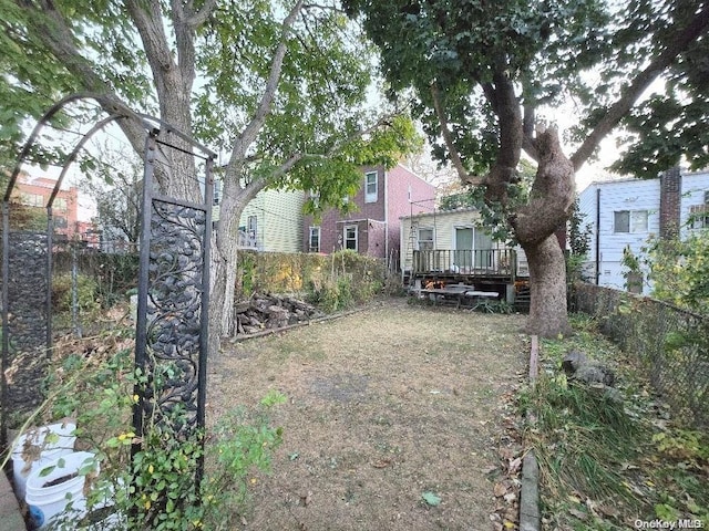 view of yard with a wooden deck