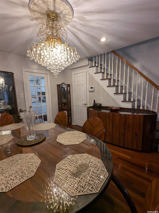 dining room featuring a notable chandelier and hardwood / wood-style flooring