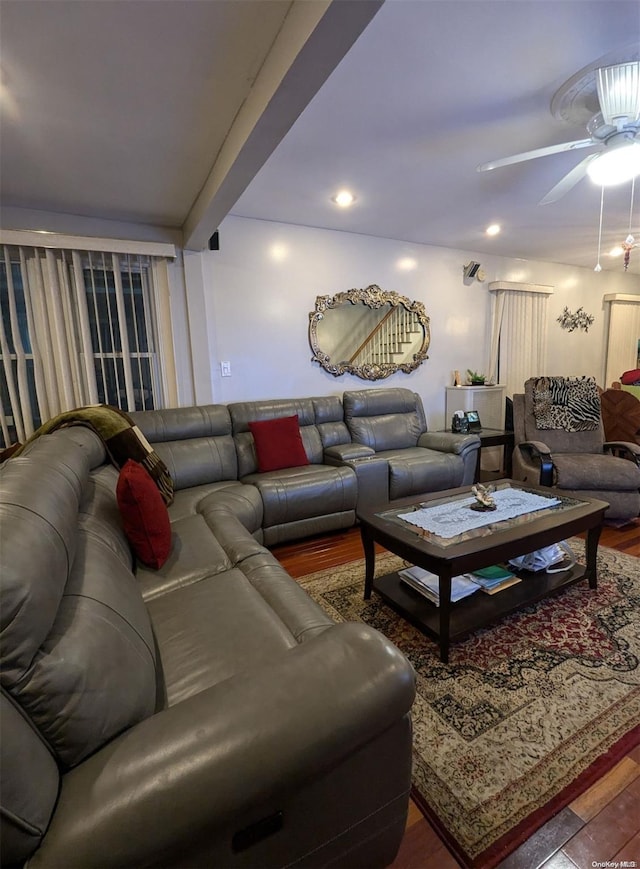 living room featuring hardwood / wood-style flooring and ceiling fan