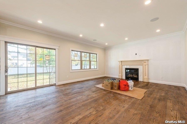 unfurnished living room with dark hardwood / wood-style flooring and ornamental molding