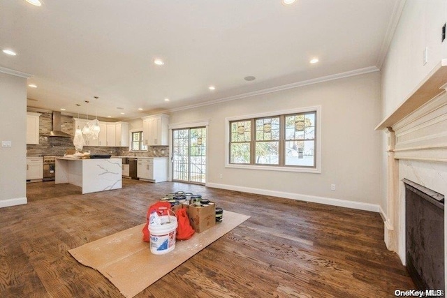 unfurnished living room with crown molding, dark hardwood / wood-style flooring, and a premium fireplace