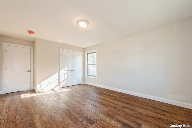 unfurnished room featuring hardwood / wood-style floors