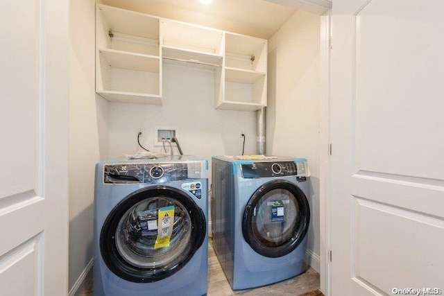 laundry room featuring washer and clothes dryer