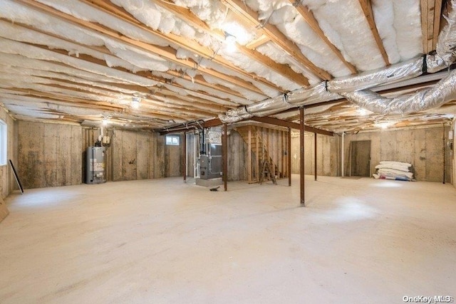 basement with gas water heater and heating unit