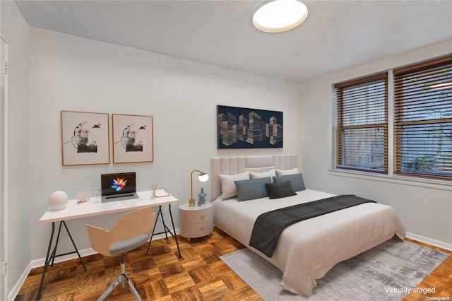 bedroom featuring parquet floors