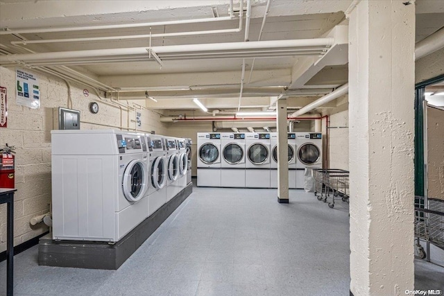 laundry room featuring washing machine and clothes dryer