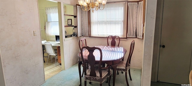 dining space with a chandelier