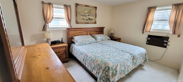 bedroom featuring light colored carpet