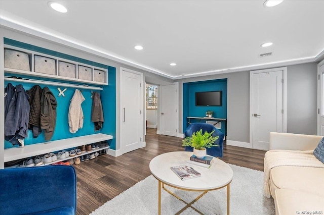 living room with dark hardwood / wood-style flooring