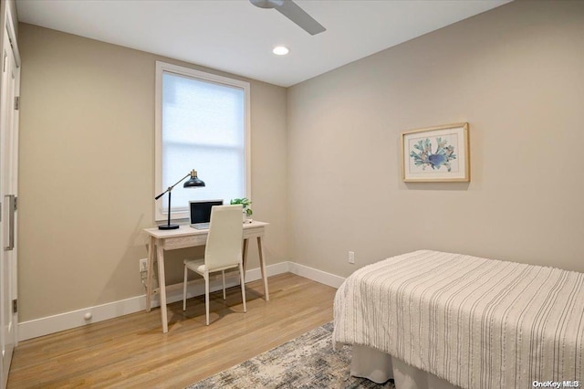 bedroom featuring light hardwood / wood-style flooring and ceiling fan