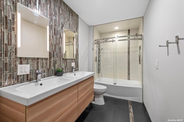 full bathroom with tasteful backsplash, vanity, enclosed tub / shower combo, tile patterned flooring, and toilet