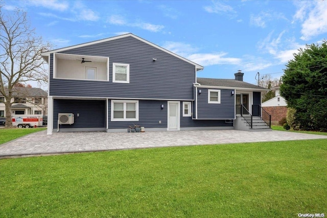 rear view of property with ceiling fan, a patio area, a yard, and ac unit