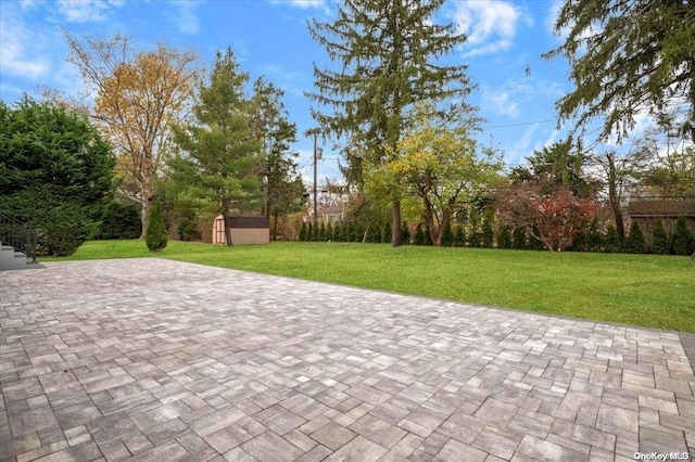 view of patio / terrace featuring a storage shed