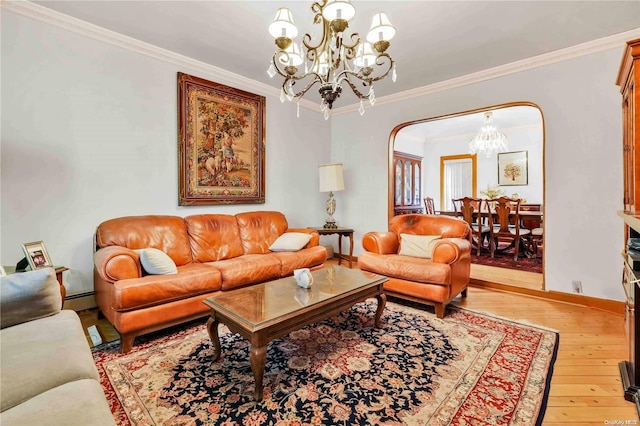 living room featuring crown molding, light hardwood / wood-style flooring, a baseboard radiator, and a notable chandelier