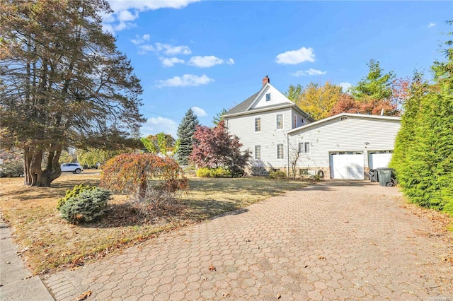 view of side of property featuring a garage