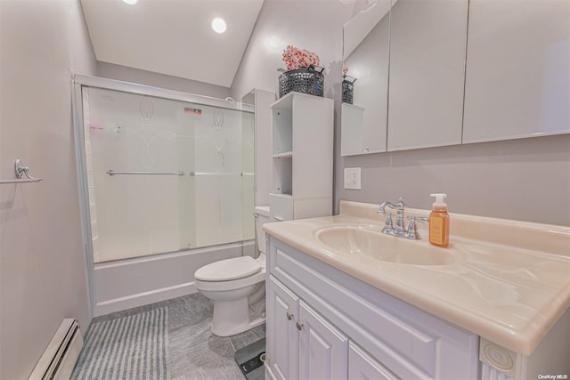 full bathroom featuring baseboard heating, combined bath / shower with glass door, tile patterned floors, toilet, and vanity