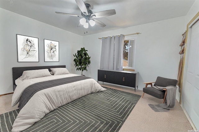 carpeted bedroom with a closet and ceiling fan