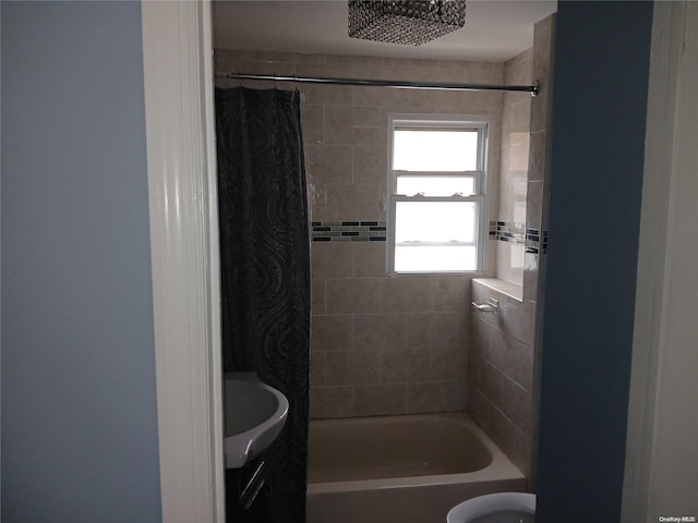 bathroom featuring shower / bath combination with curtain and vanity