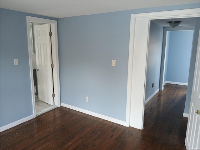 empty room featuring hardwood / wood-style flooring