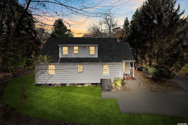 view of front of home with a yard