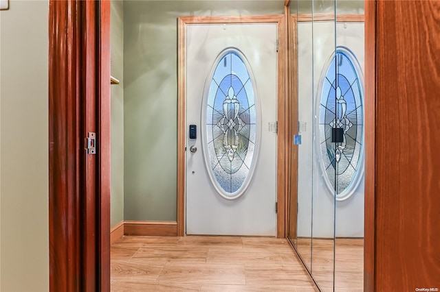 entrance foyer with light wood-style flooring