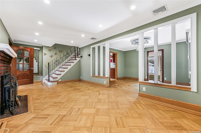 interior space featuring ornamental molding and light parquet floors